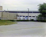 Back of Warehouse with Trucks by George Skip Gandy IV