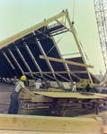 Workers Using a Crane for a Timber Beam, A by George Skip Gandy IV