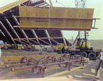 Workers Using a Crane for a Timber Beam, E by George Skip Gandy IV