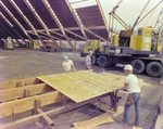 Workers Using Power Tools on Timber, K by George Skip Gandy IV