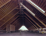 Timber Framed Structure Under Construction With Vehicles Under It by George Skip Gandy IV