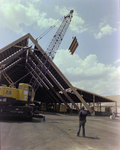 Workers Using a Crane for a Timber Beam, G by George Skip Gandy IV