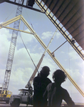 Workers Using a Crane and a Rope for a Timber Beam, B by George Skip Gandy IV