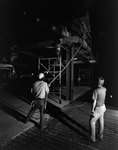 Construction Team Observing Wooden Framework at Night, B by George Skip Gandy IV