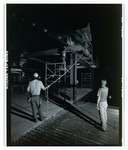 Construction Team Observing Wooden Framework at Night, C by George Skip Gandy IV