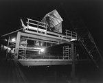 Wooden Framework on Metal Beams with Crane at Night by George Skip Gandy IV