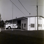 Volunteer Firefighter Bud Miller with Fire Truck at Ruskin Fire Department, A by George Skip Gandy IV