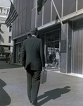 Man Holding Briefcase Approaching Marine Bank in Tampa by George Skip Gandy IV