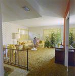 Man and Woman Sitting in Living Room at Mariners Pass Condominiums in St. Petersburg, A by George Skip Gandy IV