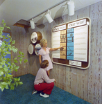 Man and Woman Viewing Information Displays at Mariners Pass Condominiums in St. Petersburg, D by George Skip Gandy IV