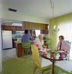 People Eating in Dining Room at Mariners Pass Condominiums in St. Petersburg, B by George Skip Gandy IV