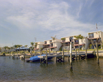 Boats Docked in Hillsborough River Behind Marina Club Condominiums in Tampa, C by George Skip Gandy IV