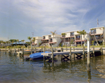 Boats Docked in Hillsborough River Behind Marina Club Condominiums in Tampa, G by George Skip Gandy IV