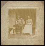 Two women Sitting on Porch with a Cat by Unknown