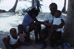 Family on Bolanos Cay, Island in Cayos Cochinos, Honduras