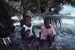 Two Young Children on Bolanos Cay, Island in Cayos Cochinos, Honduras by John C. Ogden