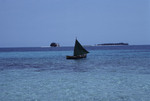 Small Boat in Water Near Bolanos Cay, Island in Cayos Cochinos, Honduras