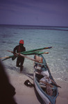 Fisherman Holds Plastic Sails on Bolanos Cay in Cayos Cochinos, Honduras