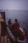 Multiple Passengers on Small Boat Near Cochino Pequeño in Cayos Cochinos, Honduras