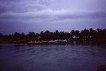 Boat of Researchers Approach Shore at South Water Caye, Belize by John C. Ogden