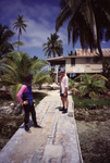 Laury McCook and Terry Done Chat in South Water Caye, Belize, A by John C. Ogden