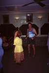 Crowd Member Dances During Performance at Pelican Beach Resort in Dangriga, Belize by John C. Ogden