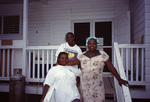 Three Cooks Pose on Porch in South Water Caye, Belize by John C. Ogden