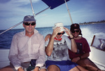 Three Researchers Smile Together on Boat Near South Water Caye, Belize by John C. Ogden