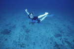 Snorkeler Smiles While Treading Water in Cut in San Pedro, Belize