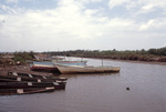 Boats Tied Ashore on Narrow Canal in Trinidad by John C. Ogden