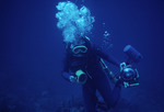 SCUBA diver with underwater camera [1]