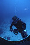 SCUBA diver with underwater camera [3]