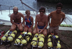 John Ogden and others kneeling in front of SCUBA oxygen tanks [1]
