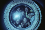 Group of people looking through the window of Hydrolab by John C. Ogden