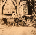 Photograph, Tom and Louise Watrous playing outside of a Farm House, circa 1920