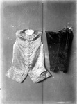 A Vest with ribbons and velvet breeches