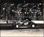 Joe Dorio Driving Stock Car, circa 1950s