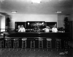Bartenders at a hotel bar by Robertson and Fresh