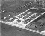 An Aerial photograph of a Gas Station and Trailer Park by Robertson and Fresh (Firm) and University of South Florida -- Tampa Campus Library