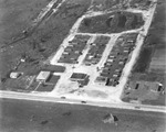 An Aerial photograph of a Gas Station and Trailer Park by Robertson and Fresh (Firm) and University of South Florida -- Tampa Campus Library