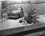 A Christmas window display at Ferman Motor Cars