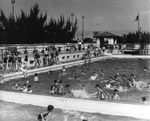 Children in a municipal pool by Robertson and Fresh