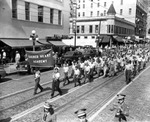 The Children of Sacred Heart Academy Marching in a Parade