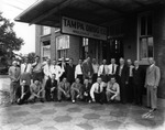 Employees pose in front of the Tampa Drug Company by Robertson and Fresh