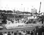 A Float advertising the movie Cinderella, complete with the pumpkin coach during the Gasparilla Parade