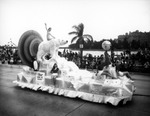 A Float with a woman sitting on a polar bear during the Gasparilla Parade