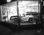 A Jeepster on Display in the Window of Sunshine Motors by Robertson and Fresh (Firm)