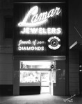 Lamar Jewelers All Lit Up at Night by Robertson and Fresh (Firm)