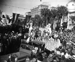 A Jeep pulls a float with some of Jose Gaspar's pirates during the Gasparilla Parade