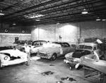Men at Work at Elkes Pontiac's Paint and Body Division by Robertson and Fresh